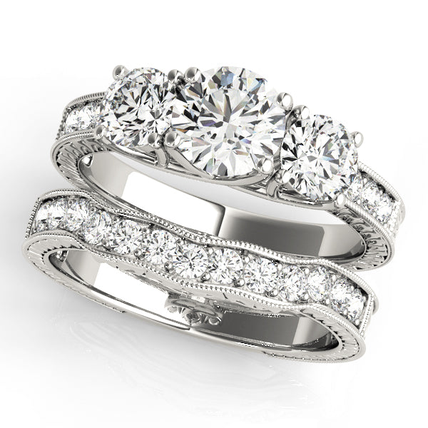 ENGAGEMENT RINGS 3 STONE ROUND